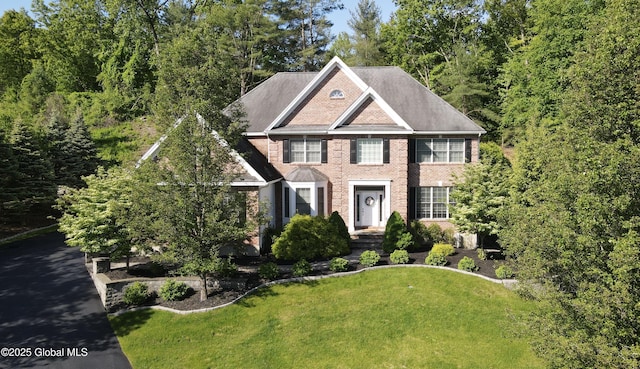 779 Waldens Pond, Guilderland, NY 12203 - view of front facade with a front yard and brick siding