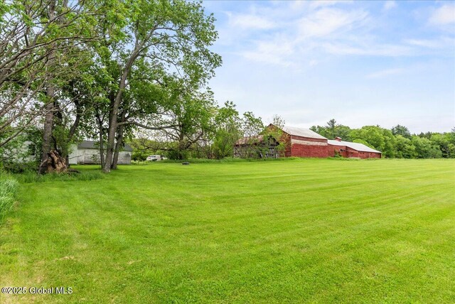 4248 Western Tpke, Guilderland, NY 12009 - view of grassy yard featuring an outbuilding and a barn