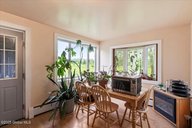 4248 Western Tpke, Guilderland, NY 12009 - sunroom / solarium featuring healthy amount of natural light and a baseboard heating unit
