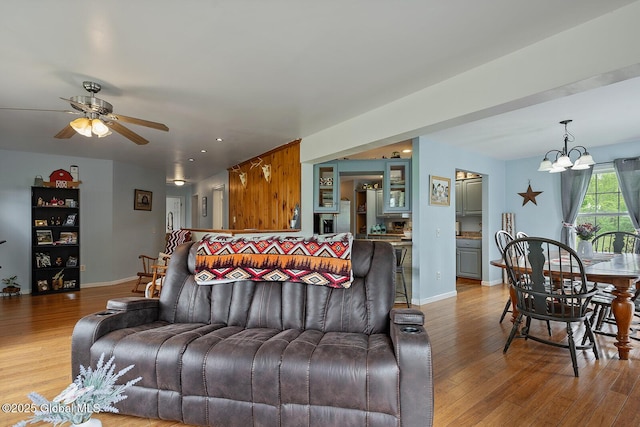 19 Lentine Way, Hebron, NY 12865 - living room featuring light wood finished floors, a ceiling fan, a chandelier, baseboards, and recessed lighting