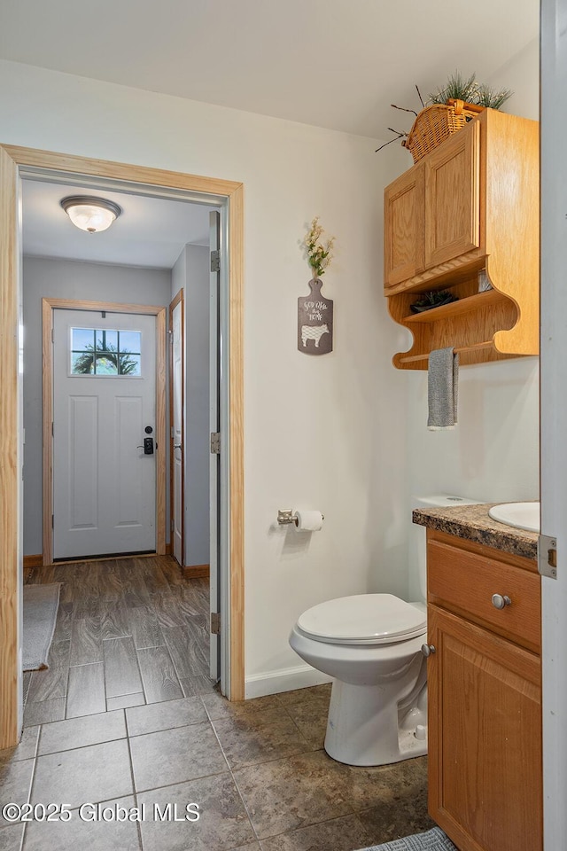 19 Lentine Way, Hebron, NY 12865 - bathroom featuring vanity, toilet, and baseboards