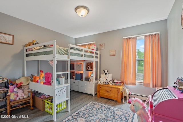 19 Lentine Way, Hebron, NY 12865 - bedroom with wood finished floors and a baseboard heating unit