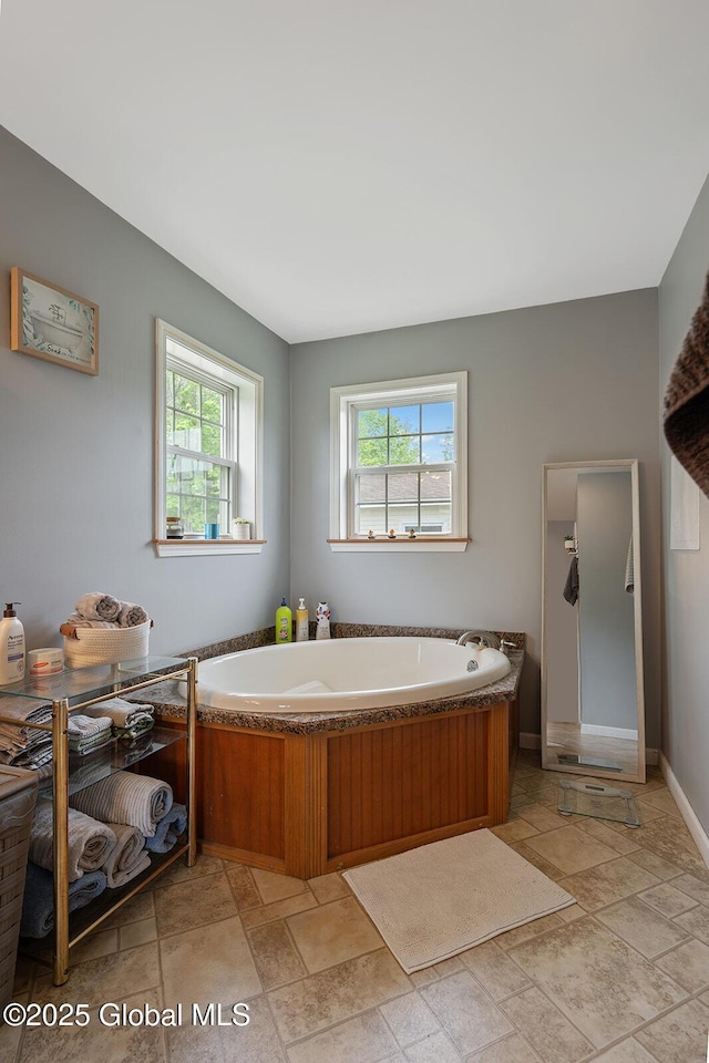 19 Lentine Way, Hebron, NY 12865 - full bath with healthy amount of natural light, a garden tub, and stone tile flooring