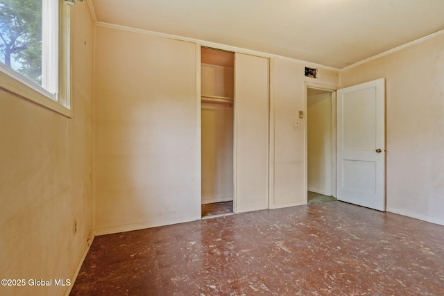 393 Whitehall Rd, Albany, NY 12208 - unfurnished bedroom featuring ornamental molding, a closet, baseboards, and tile patterned floors