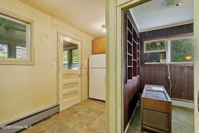 393 Whitehall Rd, Albany, NY 12208 - kitchen featuring freestanding refrigerator, a baseboard radiator, ornamental molding, and healthy amount of natural light