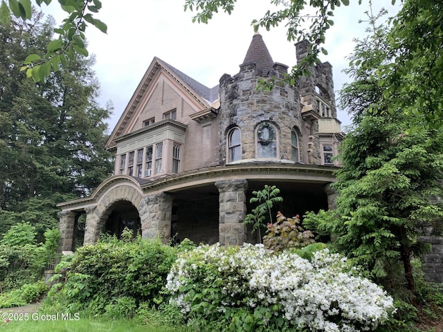 1077 University Pl, Schenectady, NY 12308 - victorian house featuring a high end roof, stone siding, and a chimney