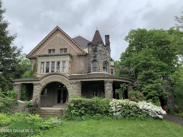 1077 University Pl, Schenectady, NY 12308 - view of front facade featuring a porch, stone siding, and a chimney