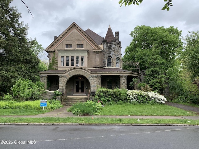 1077 University Pl, Schenectady, NY 12308 - view of front of property with stone siding, a chimney, and covered porch