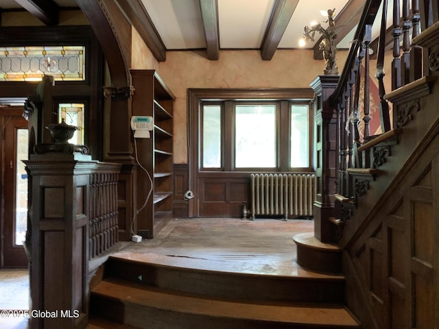 1077 University Pl, Schenectady, NY 12308 - stairs with radiator, beam ceiling, and arched walkways