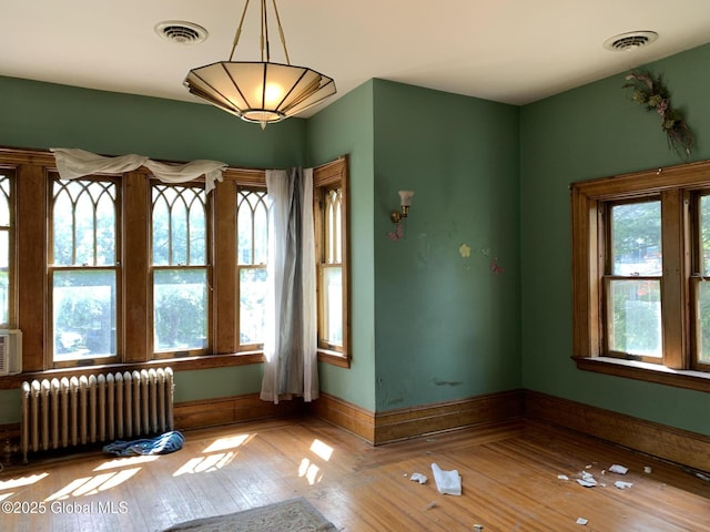 1077 University Pl, Schenectady, NY 12308 - spare room with radiator, hardwood / wood-style floors, and baseboards
