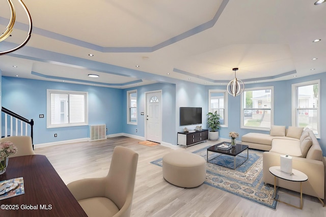 1813 Ave A, Schenectady, NY 12308 - living room with a tray ceiling, wood finished floors, and baseboards
