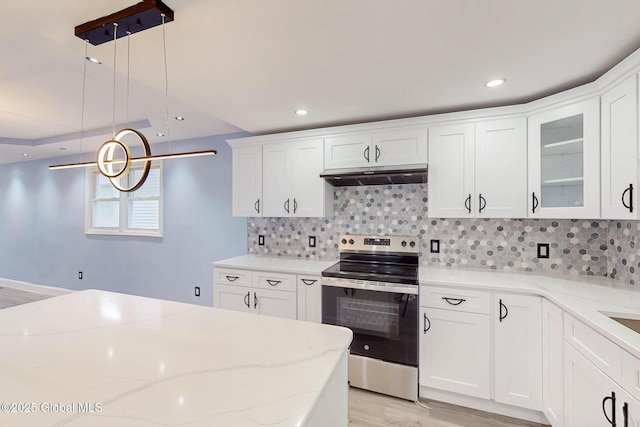 1813 Ave A, Schenectady, NY 12308 - kitchen with stainless steel electric stove, under cabinet range hood, light wood-style floors, backsplash, and recessed lighting
