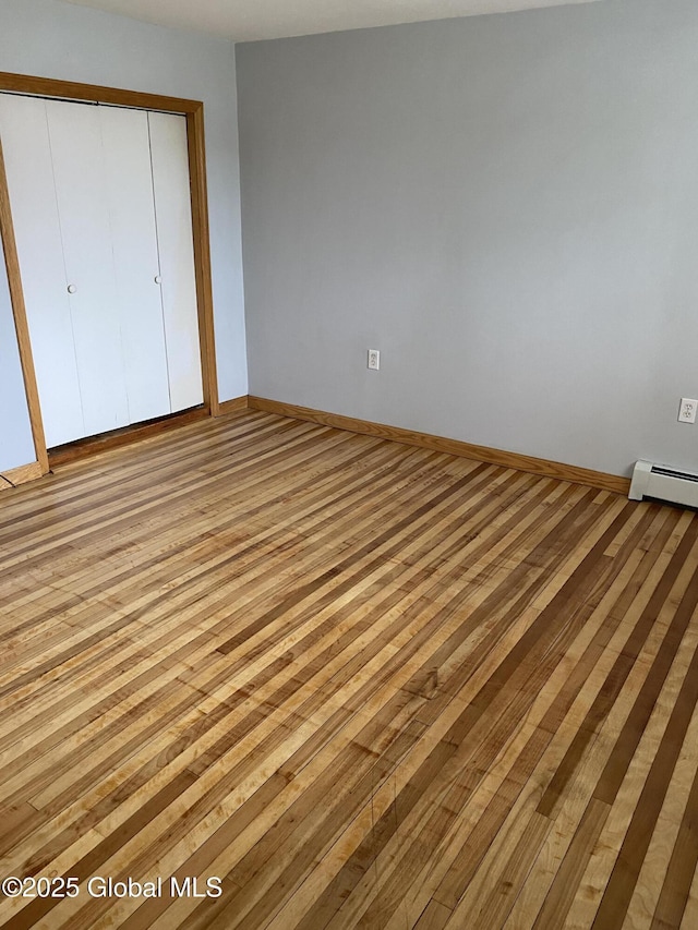 162 Garnet Lake Rd, Thurman, NY 12885 - unfurnished bedroom featuring light wood-style flooring, a closet, and baseboards