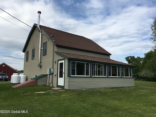162 Garnet Lake Rd, Thurman, NY 12885 - back of house with a yard and roof with shingles