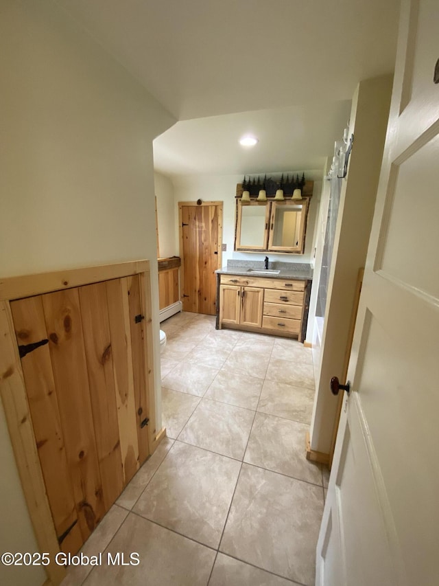 162 Garnet Lake Rd, Thurman, NY 12885 - full bathroom featuring vanity, a baseboard radiator, toilet, tile patterned flooring, and recessed lighting