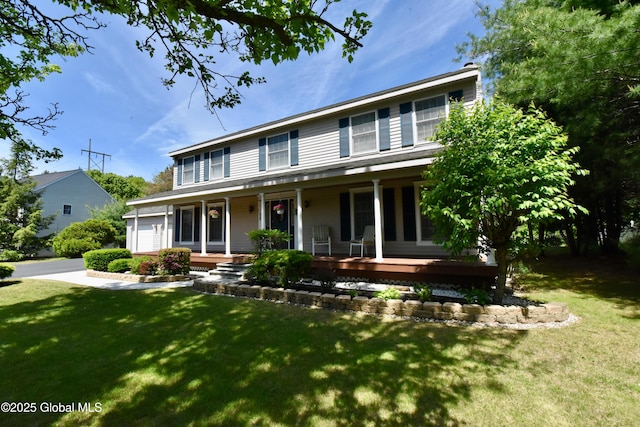110 Old Coach Rd, Clifton Park, NY 12065 - colonial home with covered porch, a front yard, and a garage