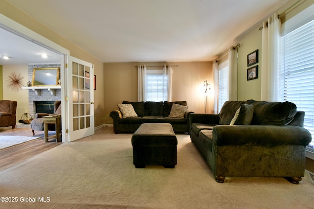 110 Old Coach Rd, Clifton Park, NY 12065 - living area with a brick fireplace, carpet floors, and baseboards