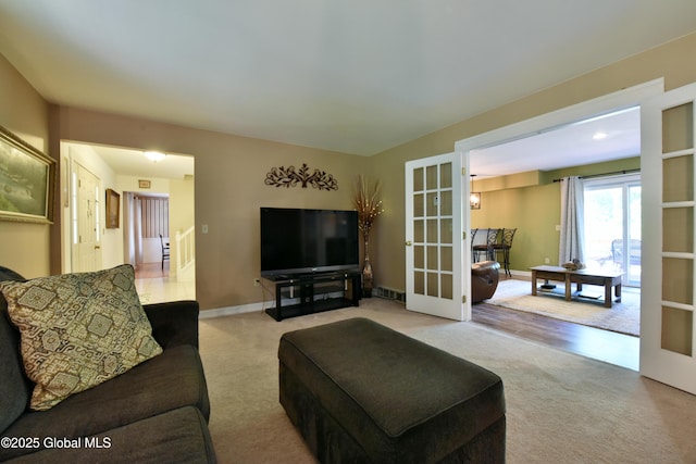 110 Old Coach Rd, Clifton Park, NY 12065 - carpeted living room with french doors and baseboards