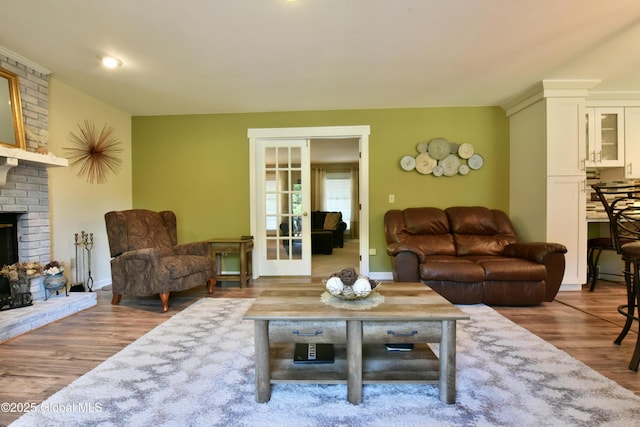 110 Old Coach Rd, Clifton Park, NY 12065 - living room with wood finished floors, a fireplace, and french doors