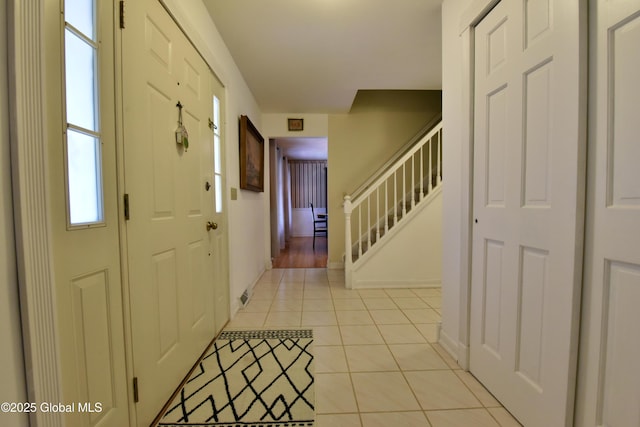 110 Old Coach Rd, Clifton Park, NY 12065 - entryway with stairs, light tile patterned flooring, and baseboards