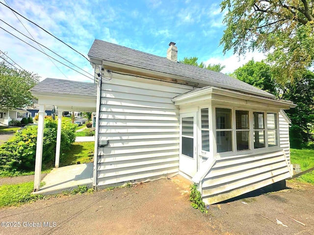 4 Ball Pl, Watervliet, NY 12189 - view of property exterior featuring a chimney and roof with shingles