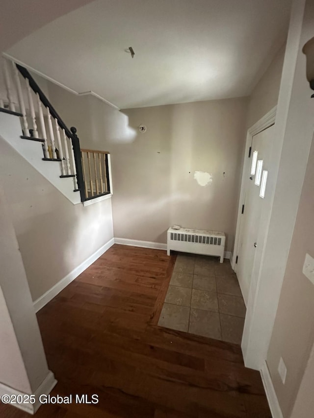 4 Ball Pl, Watervliet, NY 12189 - foyer featuring radiator heating unit, wood finished floors, stairway, and baseboards