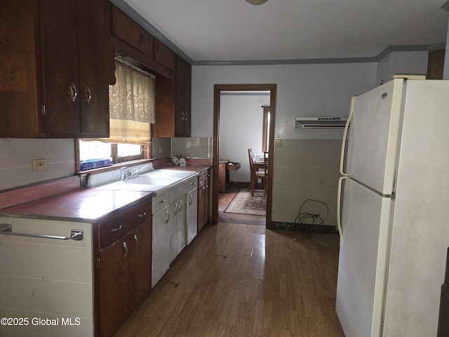 5203 State Route 167, Little Falls, NY 13365 - kitchen with freestanding refrigerator, dark wood-style flooring, a sink, ornamental molding, and dark brown cabinetry