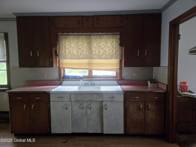 5203 State Route 167, Little Falls, NY 13365 - kitchen featuring light countertops, wood finished floors, dark brown cabinetry, and white cabinetry
