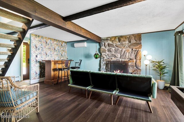 527 Nys Route 9p, Stillwater, NY 12866 - living room featuring an AC wall unit, wood finished floors, stairs, beam ceiling, and a fireplace
