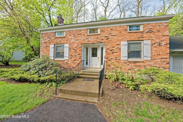 1832 Union St, Niskayuna, NY 12309 - view of front of property featuring a chimney and brick siding