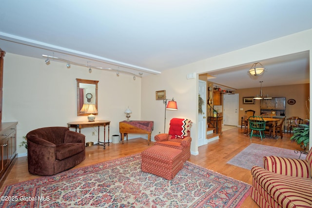 1832 Union St, Niskayuna, NY 12309 - living area with wood finished floors, track lighting, and baseboards