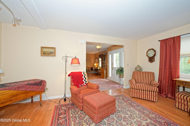 1832 Union St, Niskayuna, NY 12309 - living room with wood finished floors, healthy amount of natural light, and baseboards