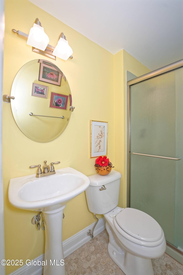 1832 Union St, Niskayuna, NY 12309 - bathroom with toilet, baseboards, a shower stall, and tile patterned flooring