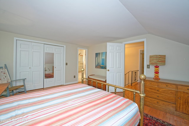 1832 Union St, Niskayuna, NY 12309 - bedroom with lofted ceiling, ensuite bath, a closet, and wood finished floors