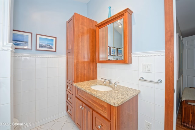 1832 Union St, Niskayuna, NY 12309 - bathroom featuring tile walls, vanity, and a wainscoted wall