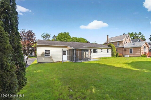 1324 Keyes Ave, Schenectady, NY 12309 - back of property with a sunroom and a yard