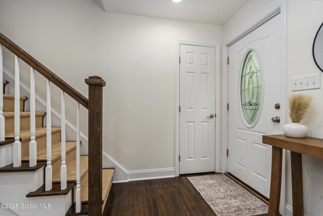 91 Gorman Rd, Menands, NY 12204 - foyer featuring dark wood-style floors, stairway, and baseboards