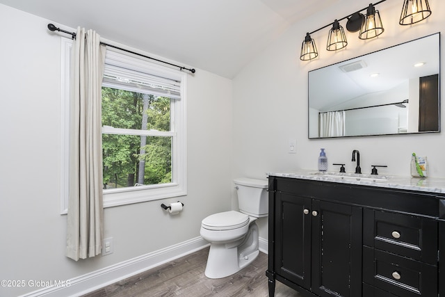 91 Gorman Rd, Menands, NY 12204 - full bath featuring lofted ceiling, vanity, toilet, wood finished floors, and baseboards