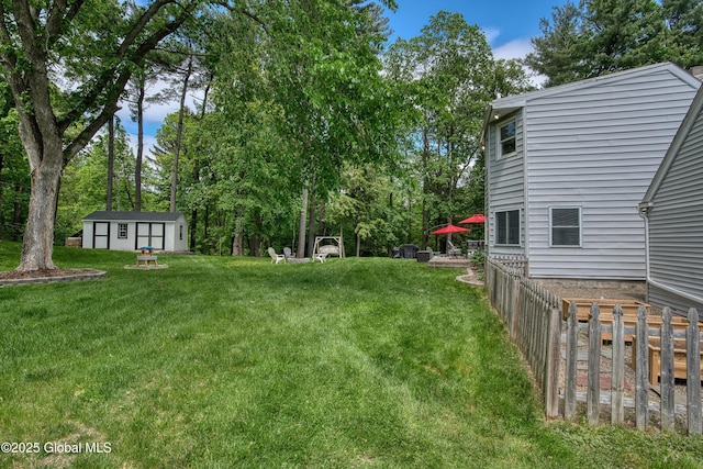 91 Gorman Rd, Menands, NY 12204 - view of yard featuring an outdoor structure and view of wooded area
