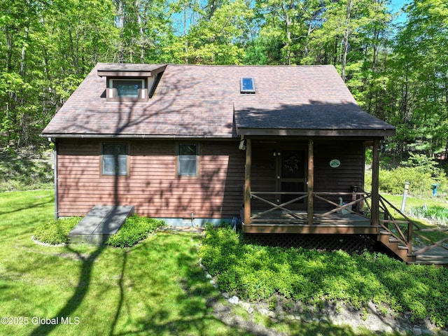 268 Dodd Hill Rd, Hague, NY 12836 - view of front facade with a front yard and roof with shingles