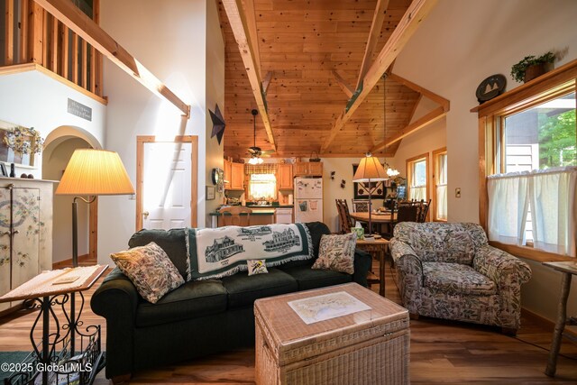 268 Dodd Hill Rd, Hague, NY 12836 - living area with high vaulted ceiling, wood finished floors, and wood ceiling with exposed beams