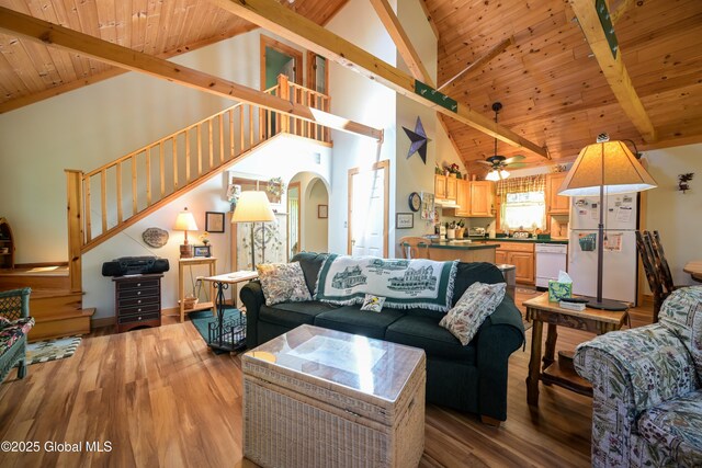 268 Dodd Hill Rd, Hague, NY 12836 - living area with stairs, wooden ceiling with exposed beams, high vaulted ceiling, arched walkways, and wood finished floors
