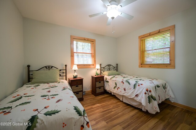 268 Dodd Hill Rd, Hague, NY 12836 - bedroom featuring wood finished floors, baseboards, and a ceiling fan