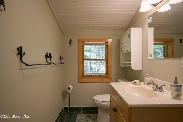 268 Dodd Hill Rd, Hague, NY 12836 - bathroom with tile patterned floors, vanity, toilet, wooden ceiling, and vaulted ceiling