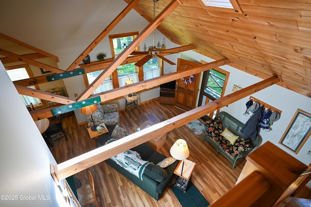 268 Dodd Hill Rd, Hague, NY 12836 - living area with lofted ceiling, ceiling fan, a skylight, and wood finished floors