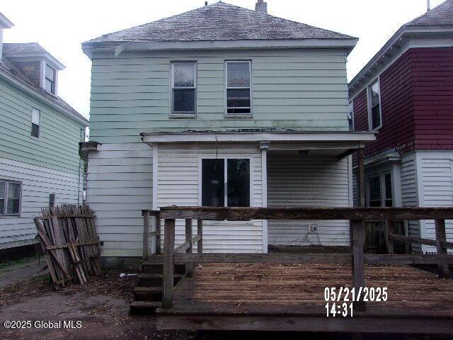 1745 Becker St, Schenectady, NY 12304 - rear view of house with a deck and a chimney
