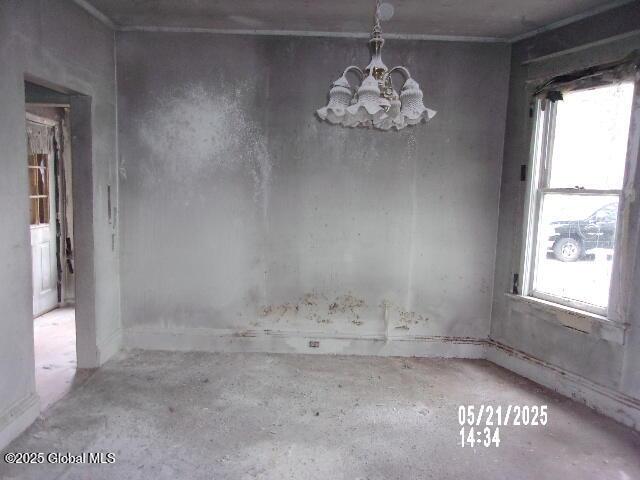 1745 Becker St, Schenectady, NY 12304 - unfurnished dining area featuring a chandelier