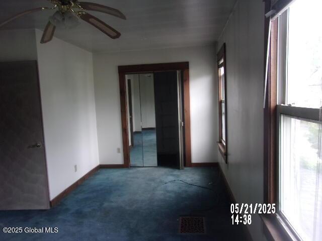 1745 Becker St, Schenectady, NY 12304 - carpeted empty room with a ceiling fan and baseboards
