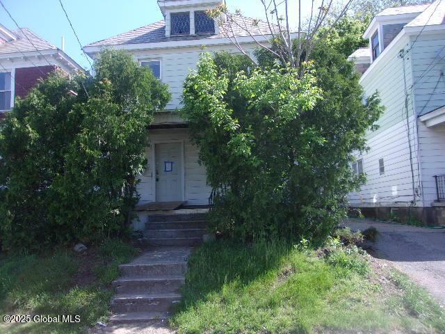 1745 Becker St, Schenectady, NY 12304 - view of property hidden behind natural elements