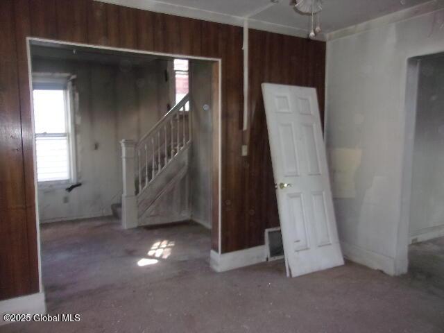 1745 Becker St, Schenectady, NY 12304 - empty room featuring stairs and wooden walls